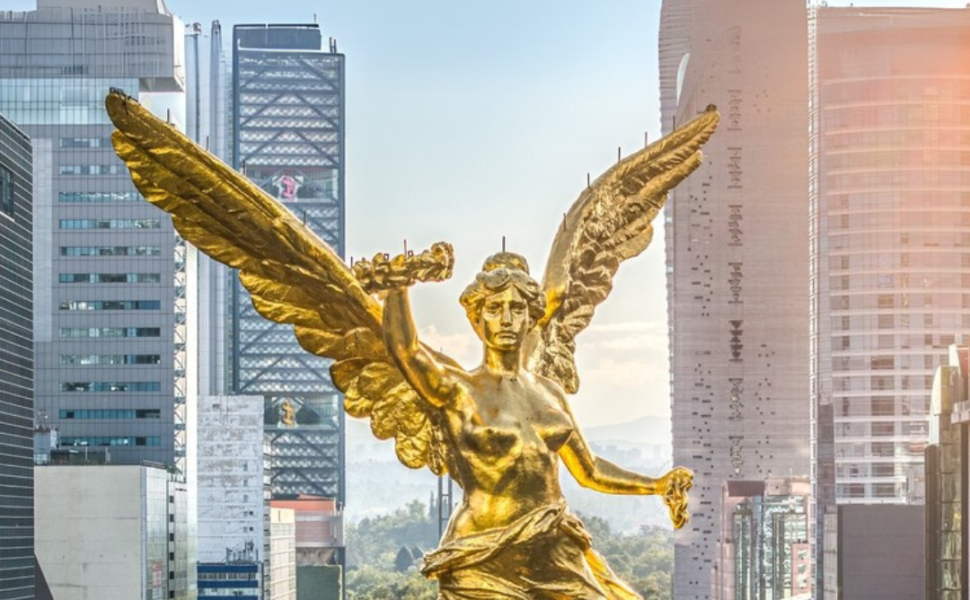 Mexico City - September 28, 2023: Aerial front view of the the Angel of Independence on Paseo de la Reforma during sunset.